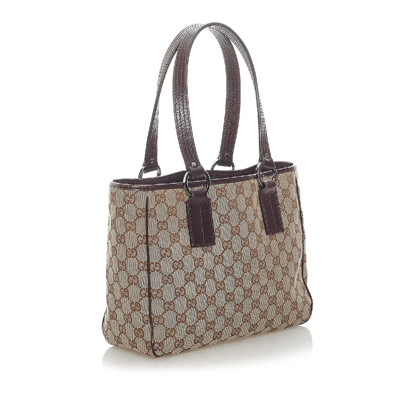 Women Gucci bags with a snap - button closure and a decorative charmGucci GG Canvas Handbag (34685)