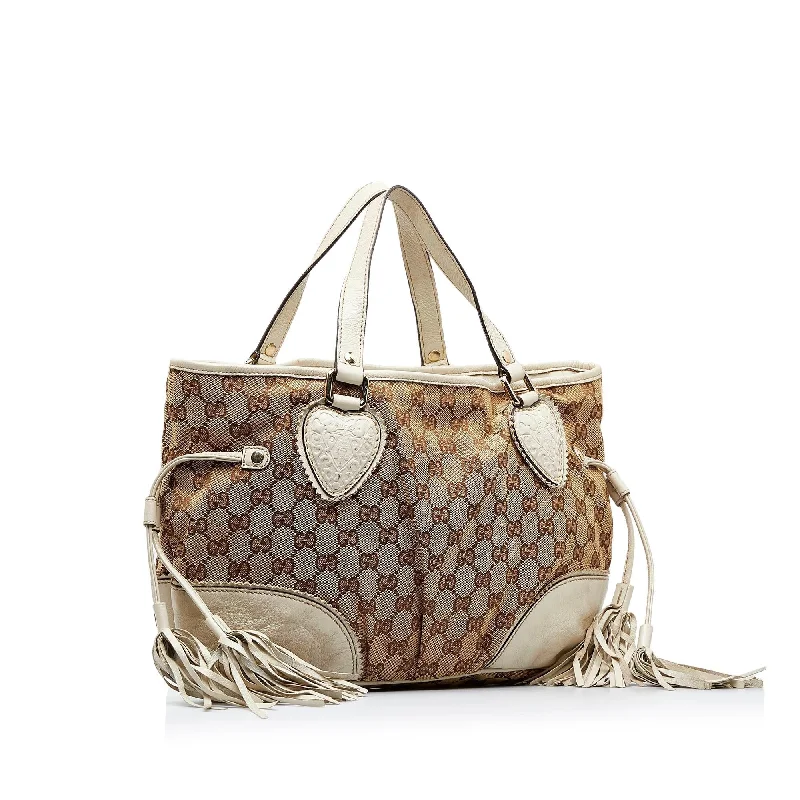 Women Gucci bags with a snap - button closure and a decorative charmGucci GG Canvas Tribeca Tote (SHG-lHMEpa)