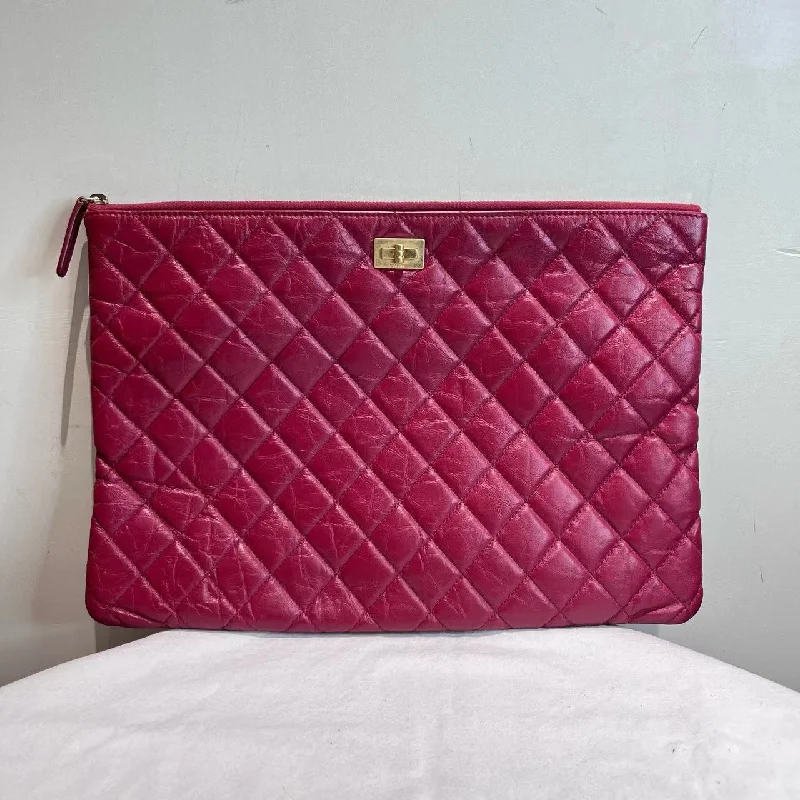 Chanel Limited Edition Handbag for CollectorsChanel O Case Raspberry Quilted Leather Clutch